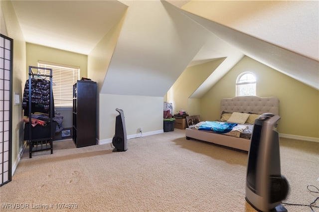 bedroom featuring light carpet and lofted ceiling