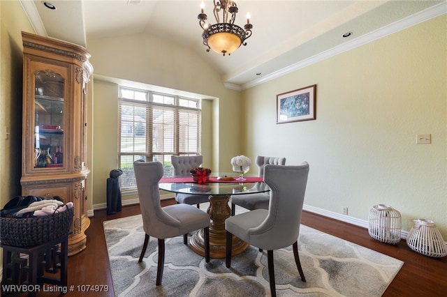 dining room featuring dark wood-type flooring and lofted ceiling