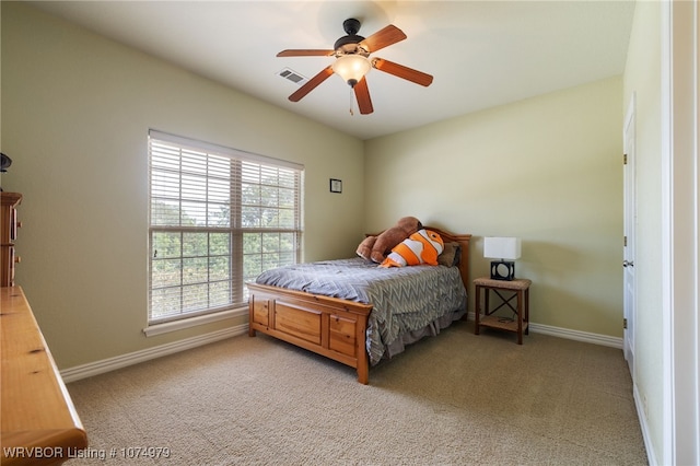 carpeted bedroom with ceiling fan