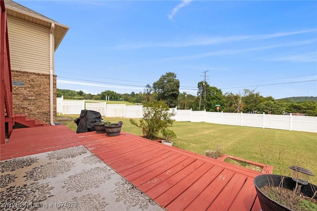 wooden deck with a yard