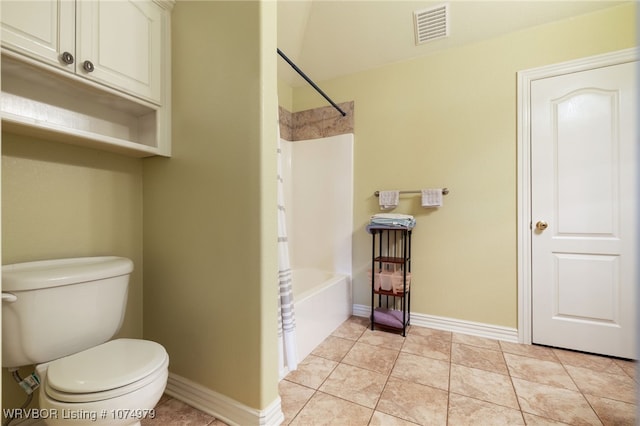 bathroom with toilet, bathtub / shower combination, and tile patterned floors