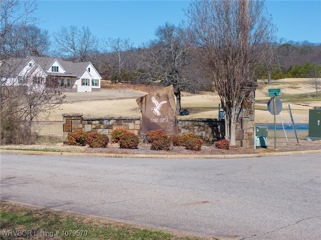 view of street with traffic signs and curbs