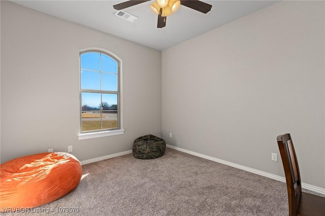 carpeted bedroom with visible vents, a ceiling fan, and baseboards