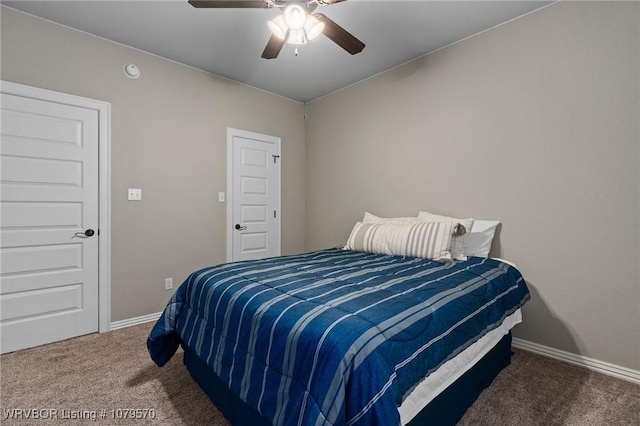 bedroom featuring baseboards, carpet floors, and a ceiling fan