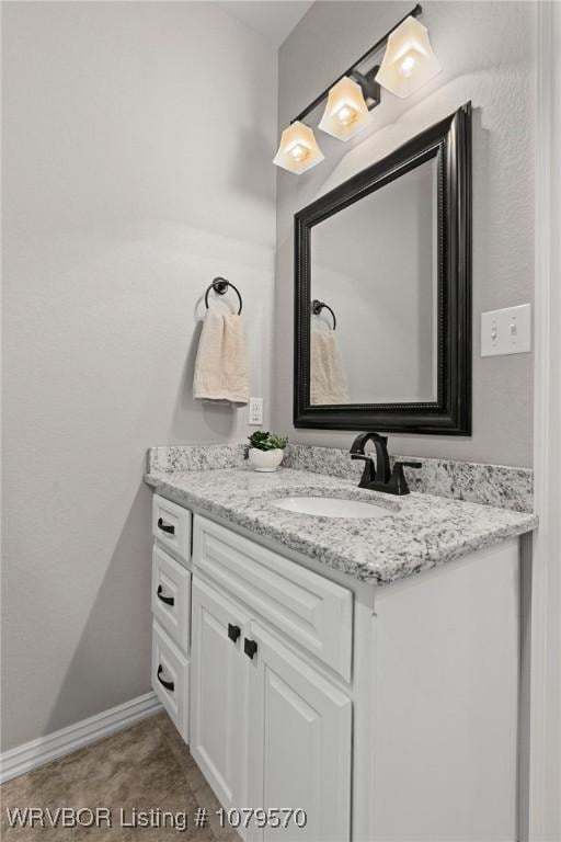 bathroom featuring vanity and baseboards