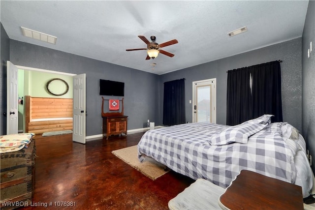 bedroom with a textured ceiling and ceiling fan