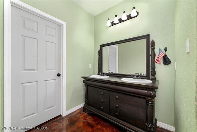bathroom featuring vanity and concrete floors