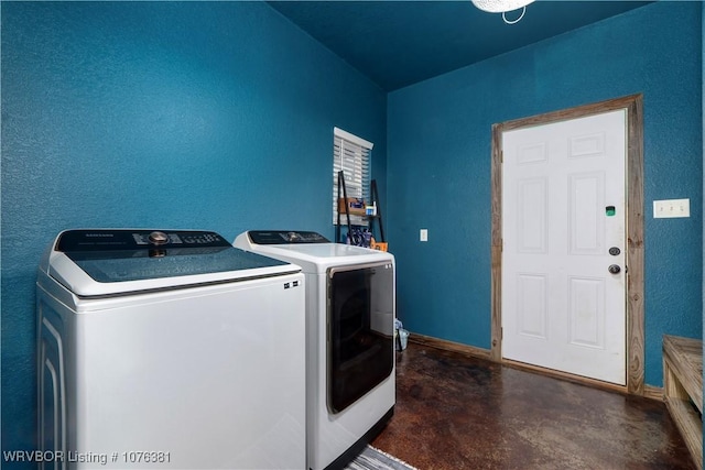clothes washing area featuring separate washer and dryer