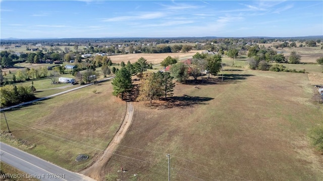 birds eye view of property with a rural view