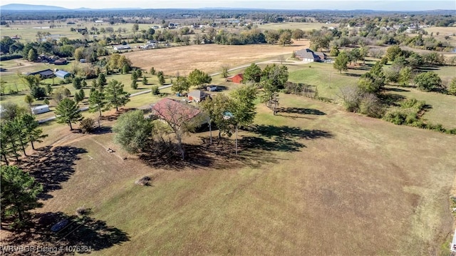 birds eye view of property with a rural view