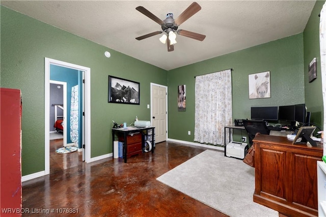 office space with ceiling fan and a textured ceiling