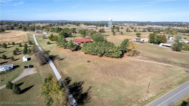 birds eye view of property featuring a rural view