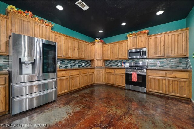 kitchen featuring decorative backsplash and stainless steel appliances