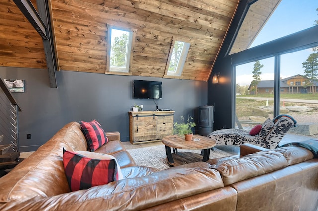 living room with high vaulted ceiling, plenty of natural light, and a skylight