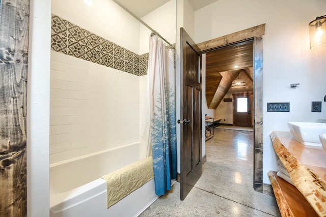 bathroom featuring vanity and shower / bath combo with shower curtain