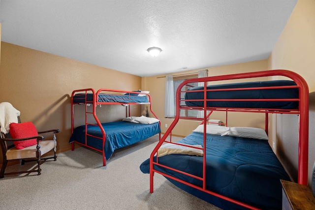 carpeted bedroom featuring a textured ceiling