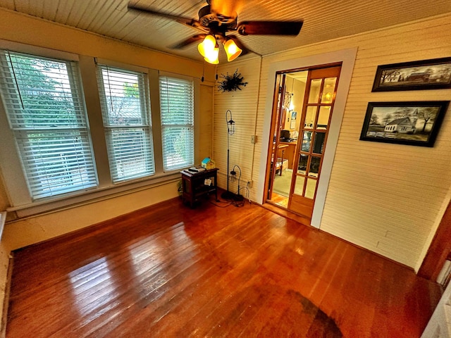 spare room with ceiling fan and dark hardwood / wood-style flooring