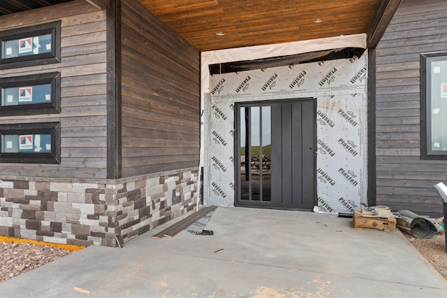 doorway to property featuring a patio area