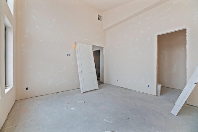 unfurnished room featuring visible vents