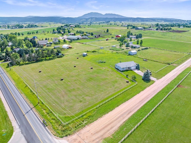 drone / aerial view featuring a mountain view and a rural view