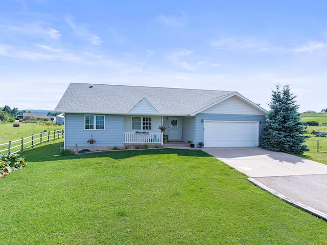 single story home featuring a porch, a garage, and a front yard