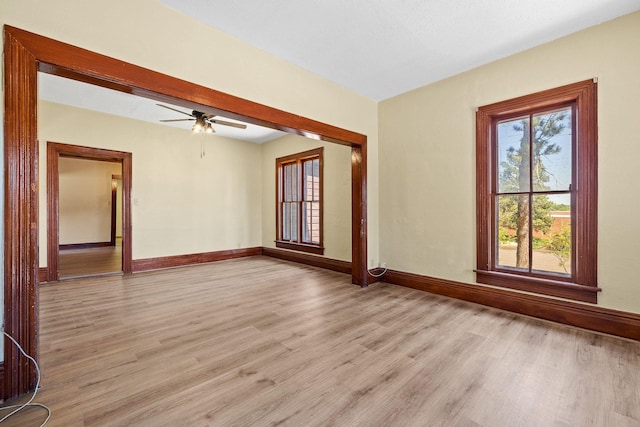 empty room featuring ceiling fan and light hardwood / wood-style floors