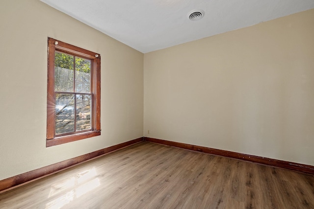 spare room featuring hardwood / wood-style flooring