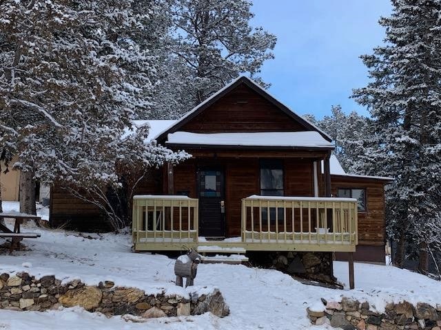 log-style house with a porch