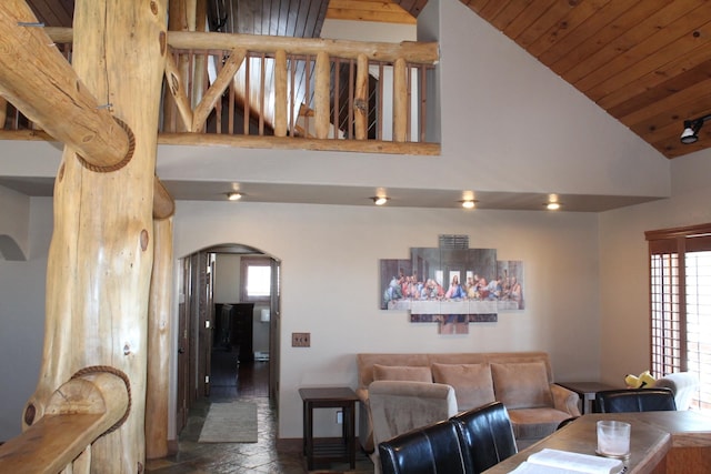 living room featuring wood ceiling and high vaulted ceiling