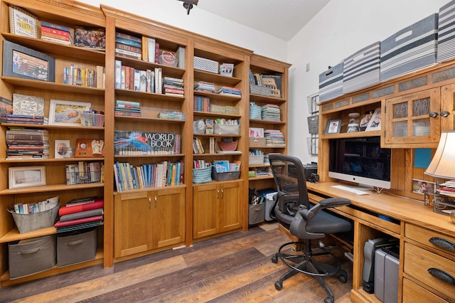 office space featuring built in desk and dark wood-type flooring