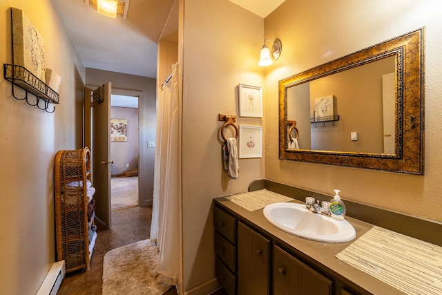 bathroom featuring a baseboard heating unit and oversized vanity