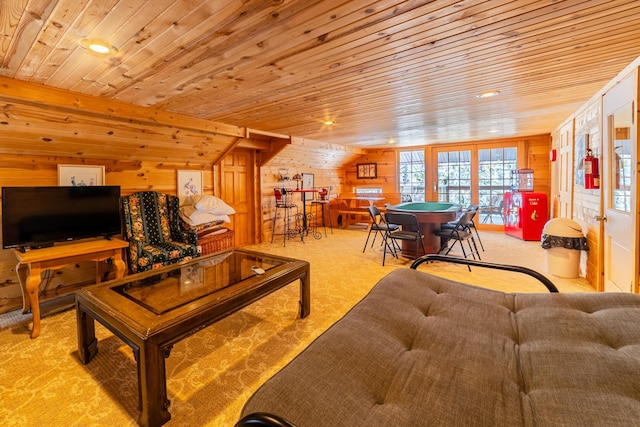 living room featuring light colored carpet, wood ceiling, french doors, and wood walls