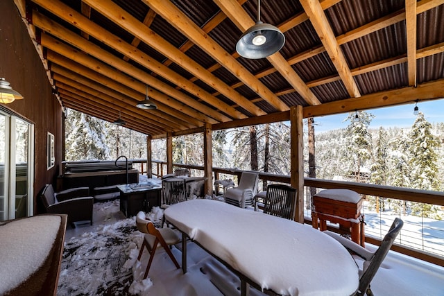 sunroom / solarium featuring lofted ceiling and a wealth of natural light