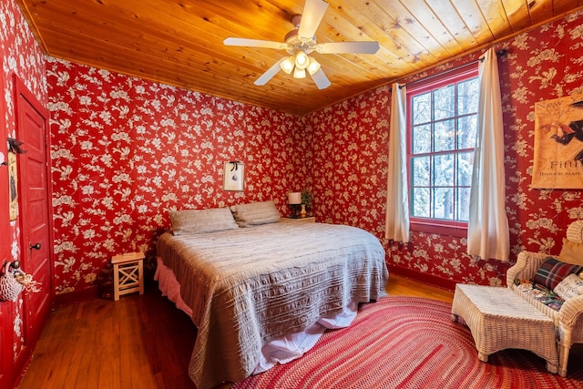 bedroom featuring wood ceiling, ceiling fan, and dark hardwood / wood-style floors