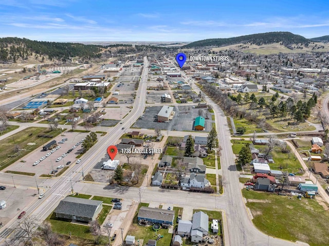 drone / aerial view featuring a mountain view