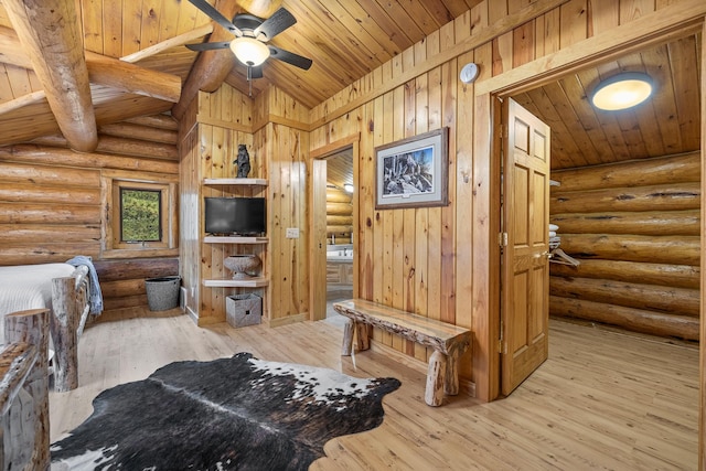 bedroom featuring light hardwood / wood-style flooring, log walls, wooden ceiling, and lofted ceiling