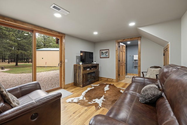 living room with light hardwood / wood-style flooring