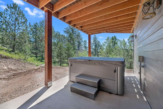 view of patio with a hot tub