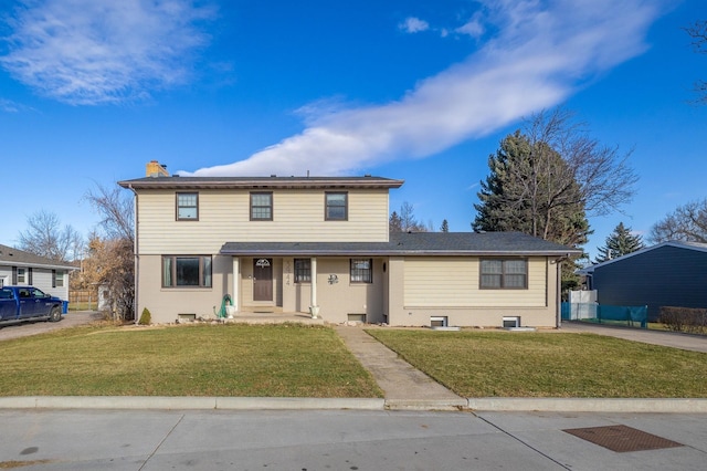 front facade with a front yard