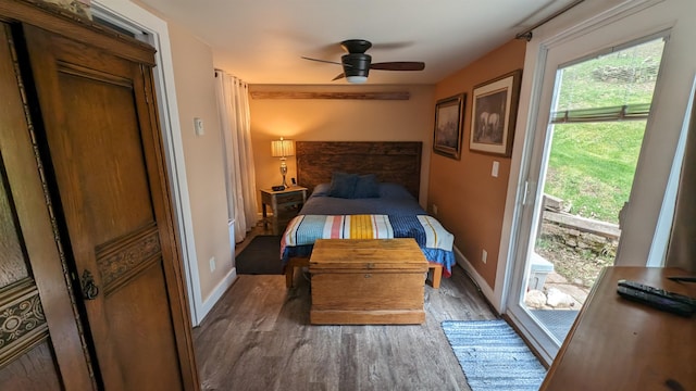 bedroom with hardwood / wood-style floors, ceiling fan, and access to outside