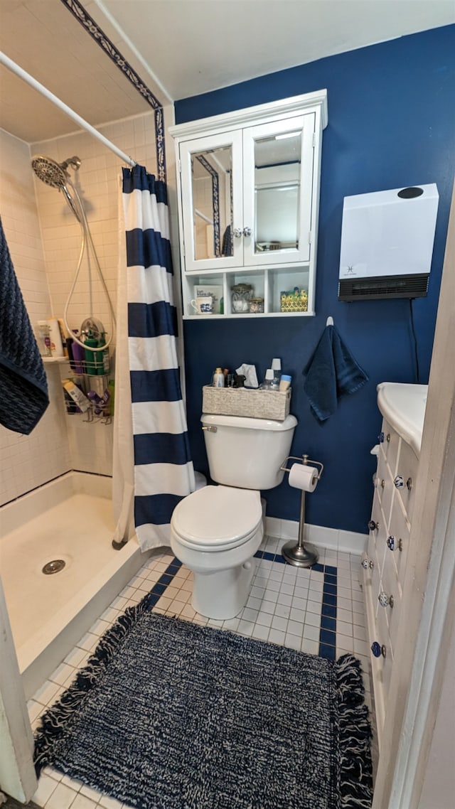 bathroom with curtained shower, toilet, tile floors, and vanity