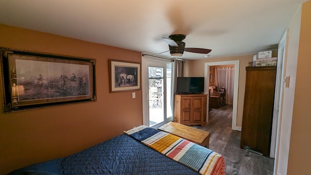 bedroom featuring ceiling fan and dark hardwood / wood-style floors