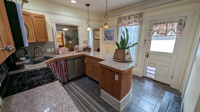 kitchen featuring dark tile floors, tasteful backsplash, stainless steel dishwasher, decorative light fixtures, and kitchen peninsula