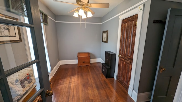 corridor with plenty of natural light and dark wood-type flooring