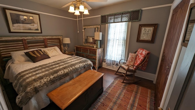 bedroom featuring a closet, ceiling fan, and dark hardwood / wood-style floors