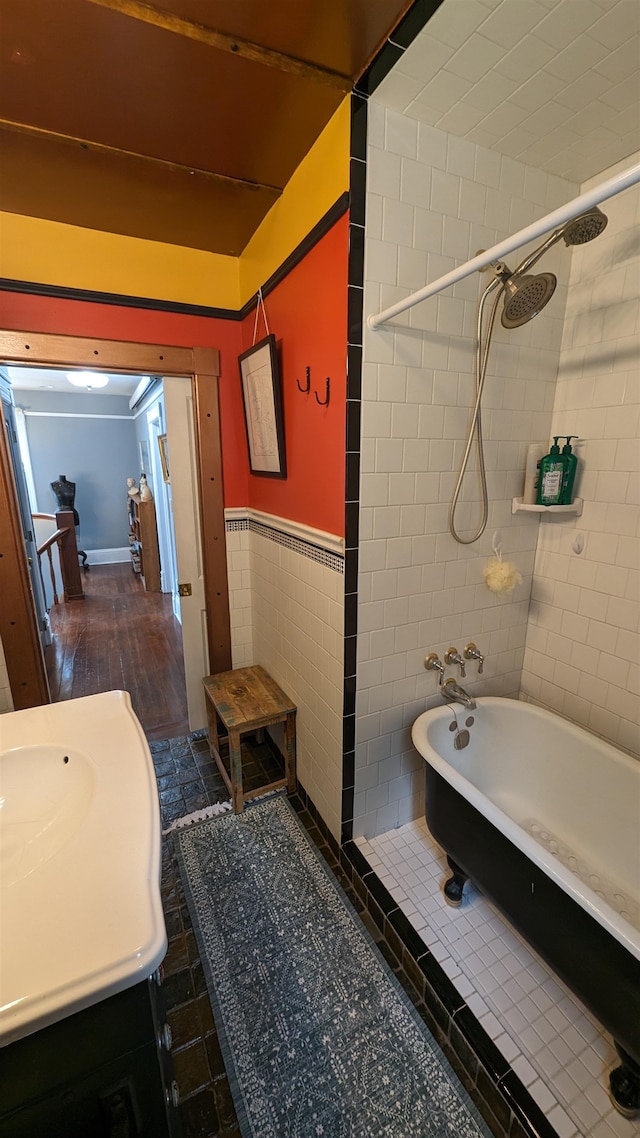 bathroom featuring tile walls, tile floors, and vanity