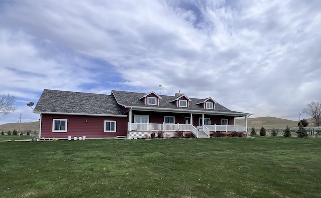 view of front of home featuring covered porch and a front yard