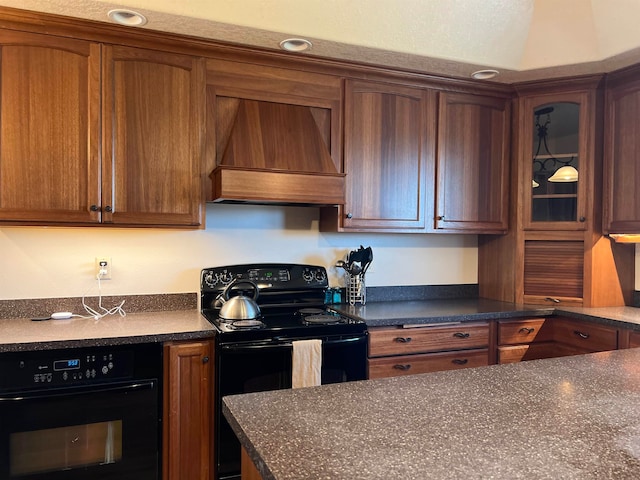 kitchen with premium range hood and black appliances