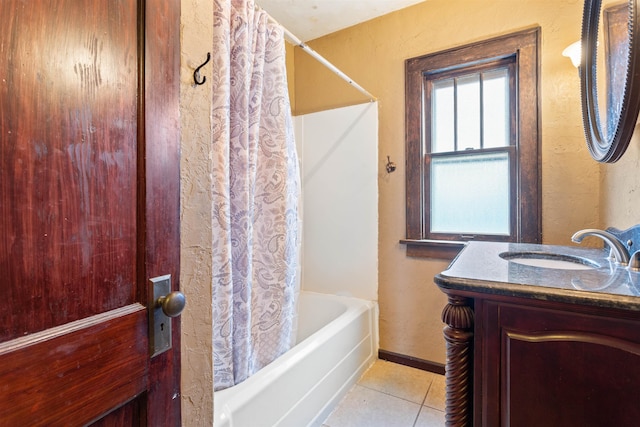 bathroom with tile flooring, vanity, and shower / bath combo