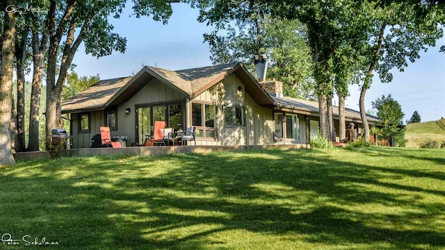 view of home's exterior with a lawn